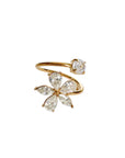 Gold and diamond flower-shaped ring on a white background