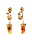 Gold earrings with amber-colored gemstones on a white background