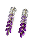 Purple and clear leaf-shaped earrings on a white background