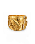 Gold bracelet with leaf design on a white background
