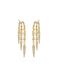 Gold hoop earrings with spike designs on a white background