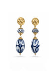 Pair of gold and blue beaded earrings on a white background