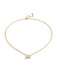 Gold necklace with a small pendant on a white background