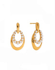 Gold hoop earrings with pearl-like stones on a white background