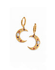 Gold moon-shaped earrings with colorful gemstones on a white background