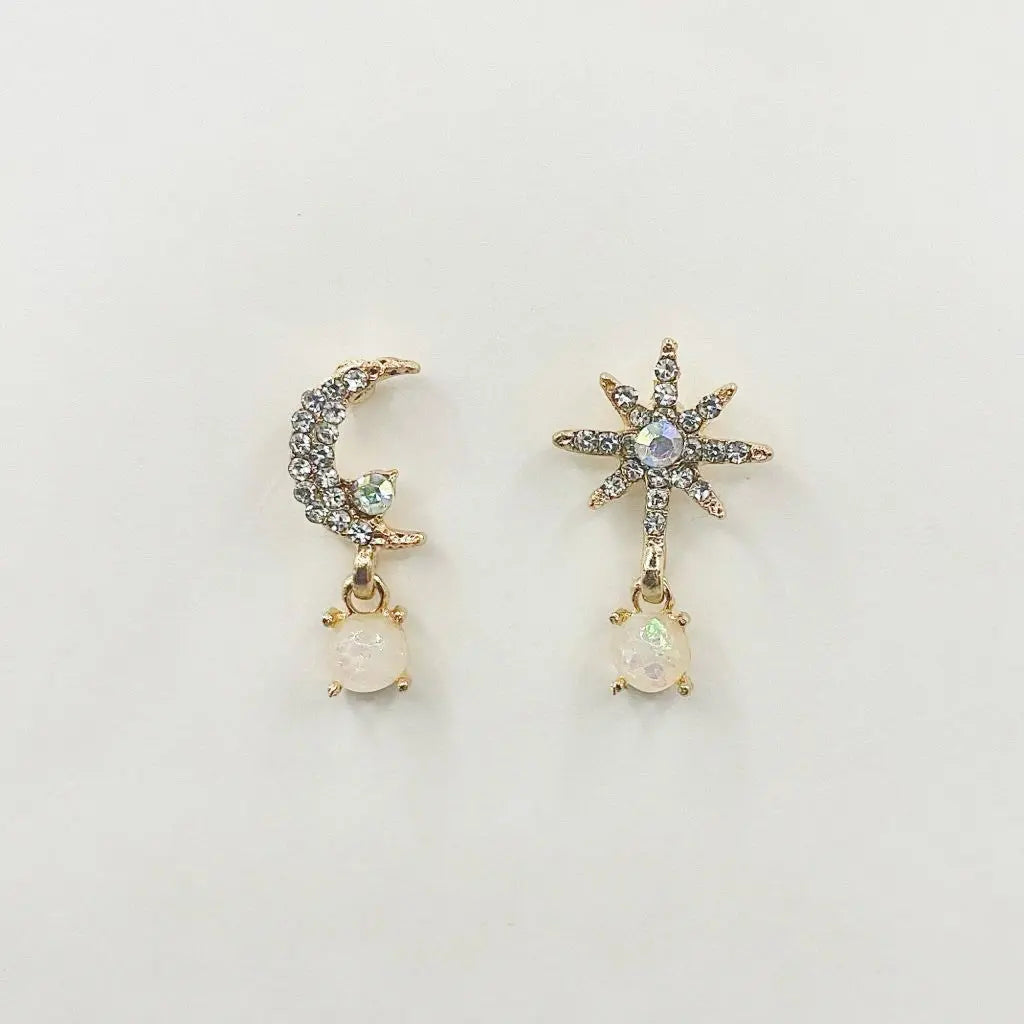 The Art of Mismatched Moon and Star Earrings: A Celestial Twist