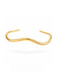Gold nose ring on a white background
