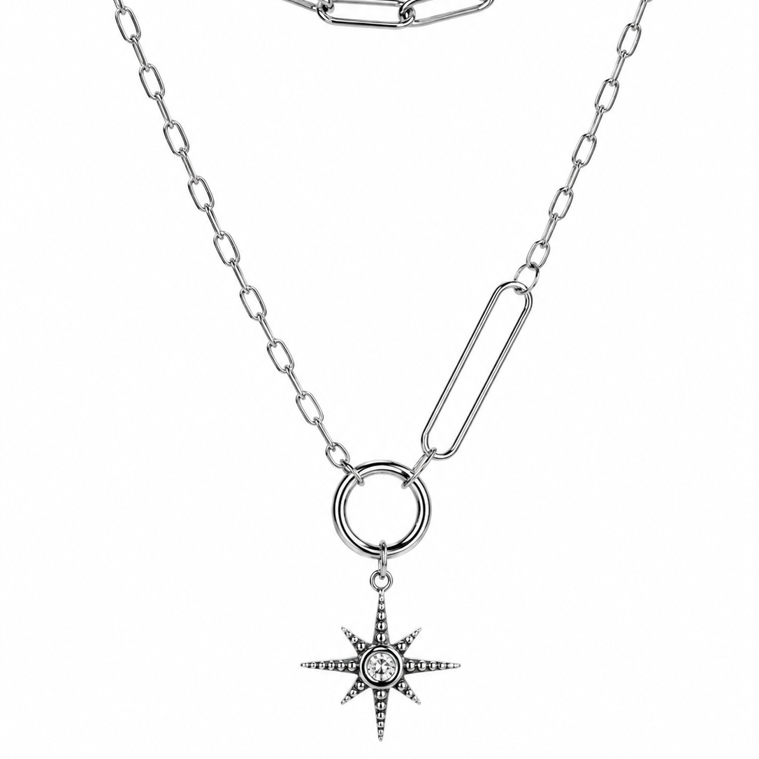 Silver chain necklace with a star-shaped pendant on a white background