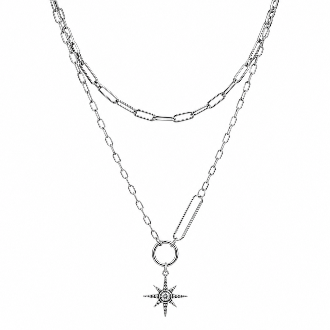 Two silver chain necklaces with star pendants on a white background