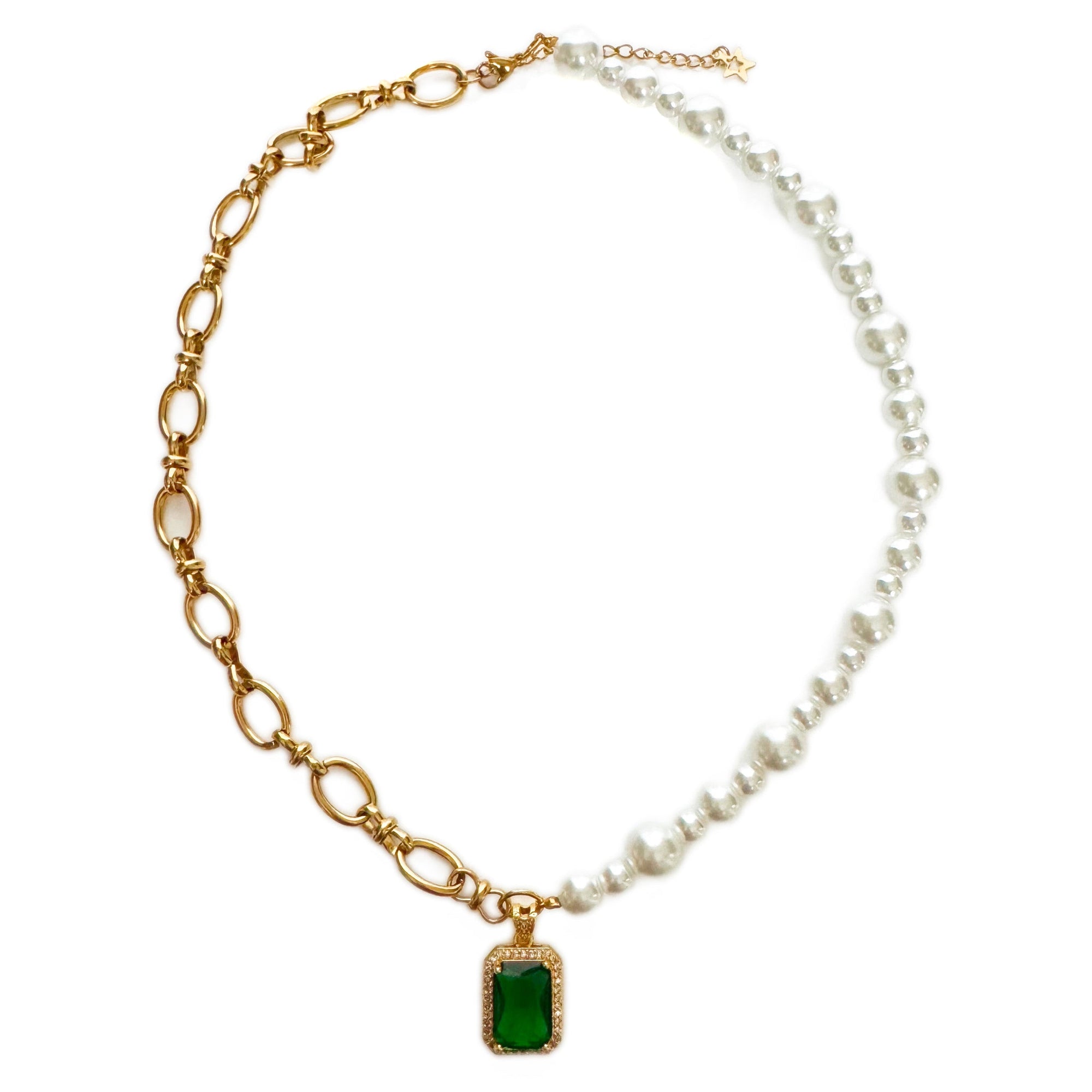 Necklace with gold chain, green gemstone pendant, and pearl strand on a white background