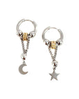 A pair of silver hoop earrings with one earring featuring a crescent moon charm and the other with a star charm, suspended from delicate chains.