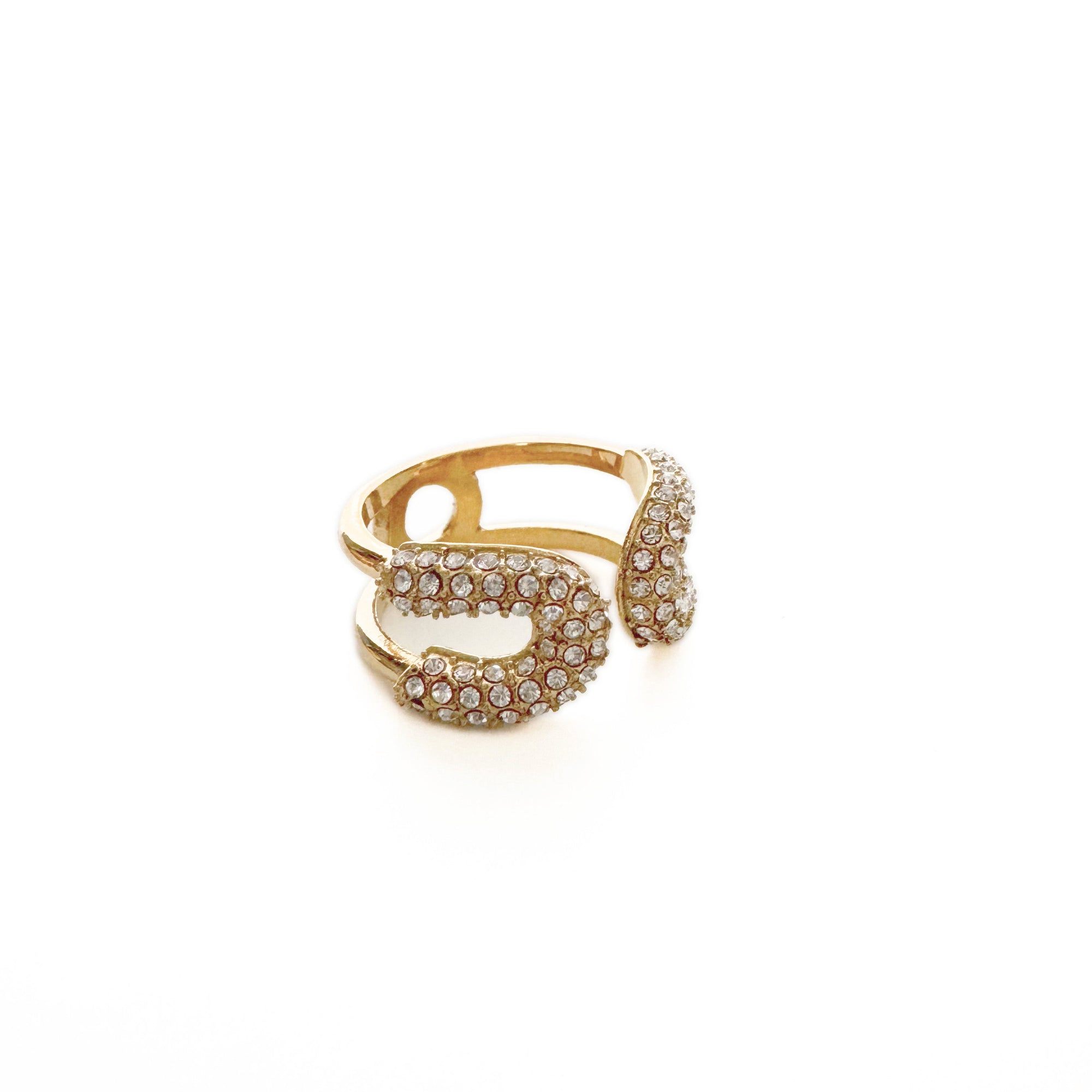 Gold ring with gemstones on a white background