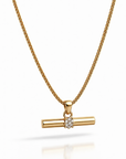 Gold necklace with a bar pendant on a white background
