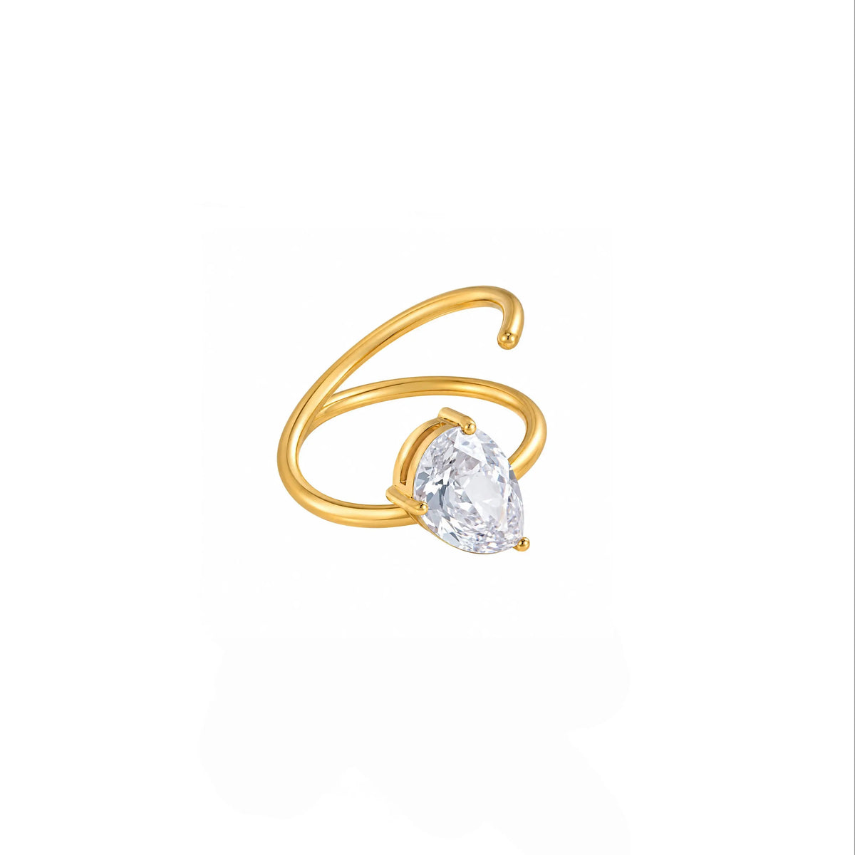 A gold ring featuring a pear-cut clear gemstone in a prong setting, set against a plain white background.