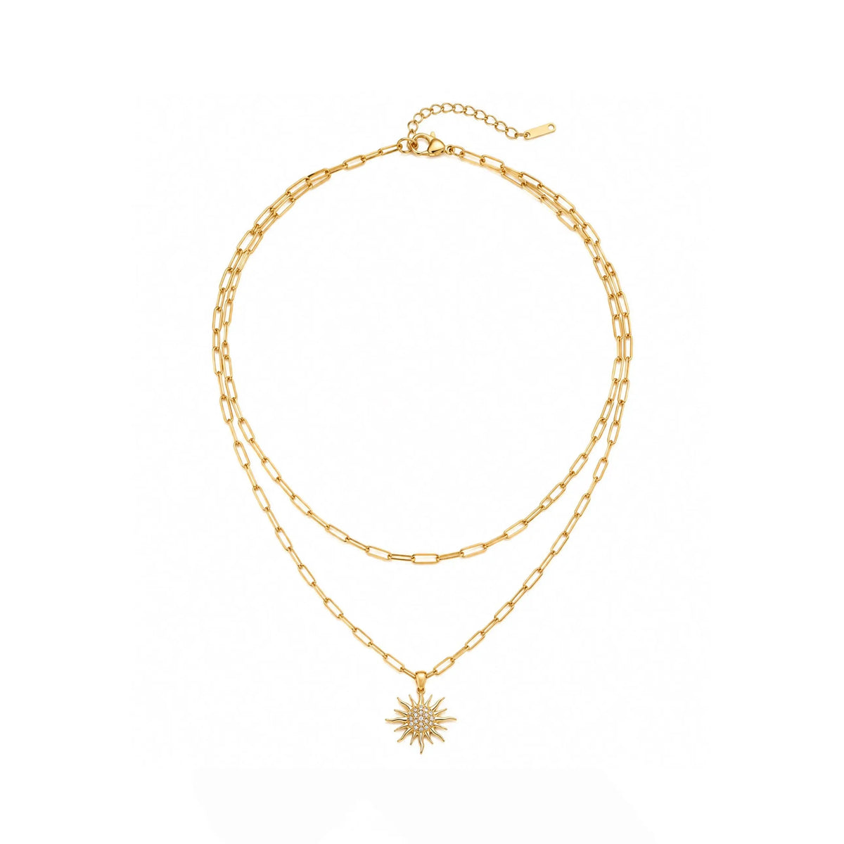 A double-layered gold chain necklace with a small starburst sun pendant, displayed on a clean white background.