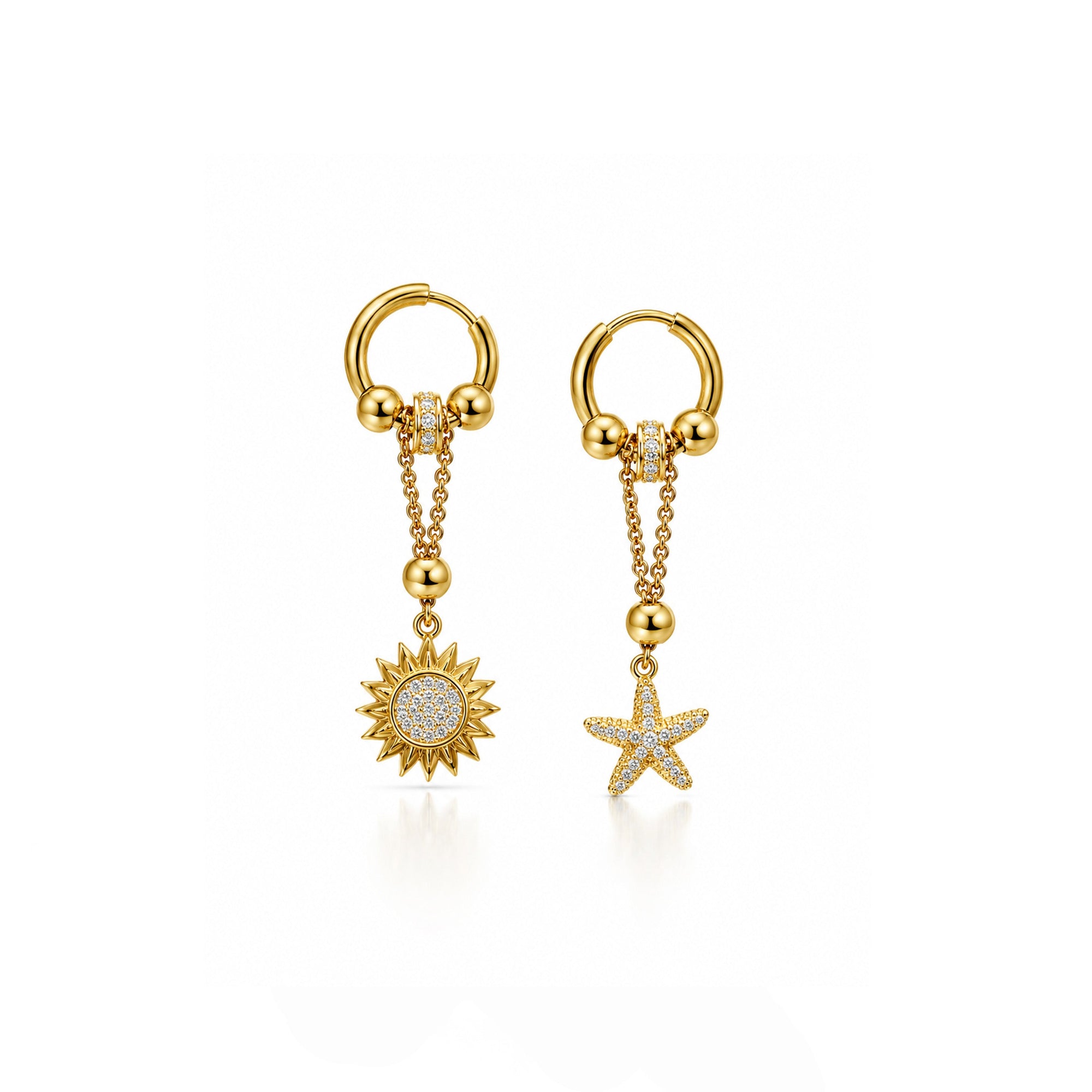 Gold earrings with sun and star designs on a white background