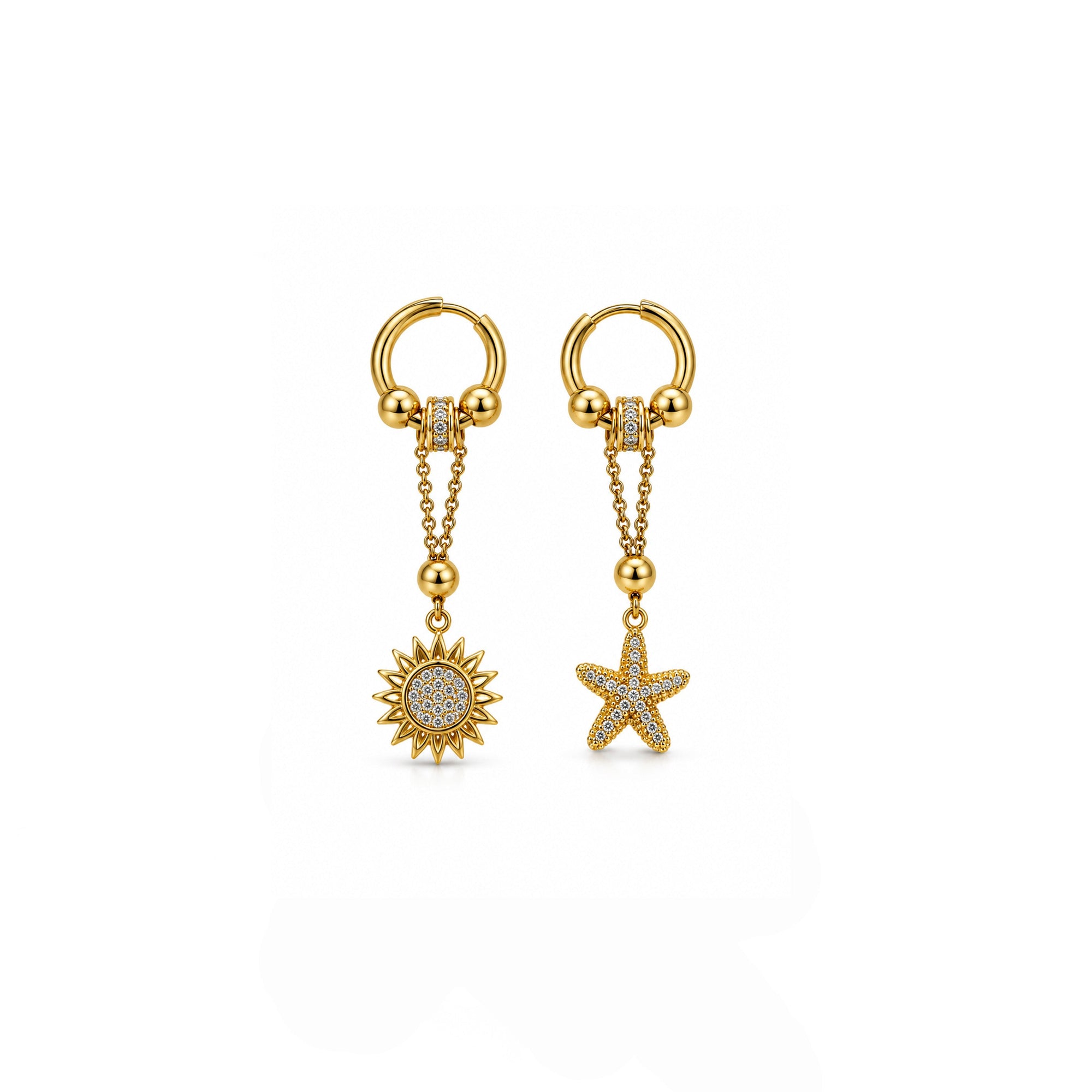 Gold earrings with sun and star charms on a white background