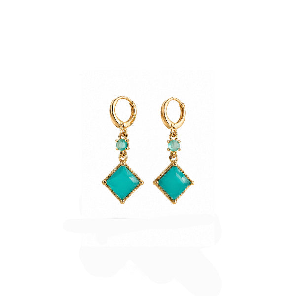 Pair of turquoise earrings with gold hooks on a white background